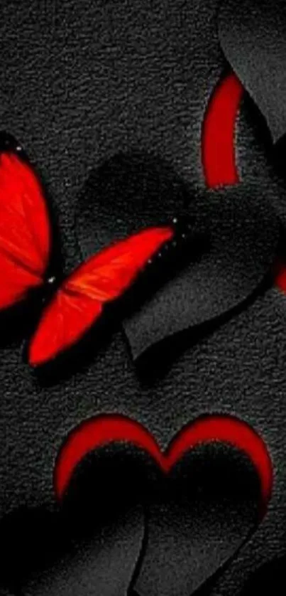 Red butterfly among black hearts on textured wallpaper.