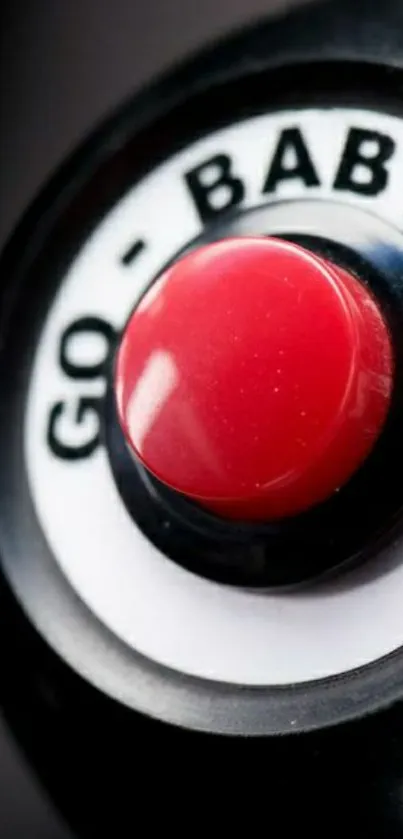 Close-up of a red button labeled "Go Baby" on a black background.