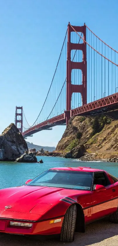 Red sports car near Golden Gate Bridge with blue sky.