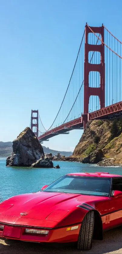 Red car with Golden Gate Bridge in the background on a sunny day.