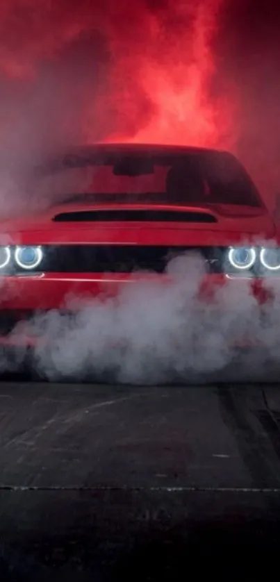 Red sports car emerging through smoke at night.