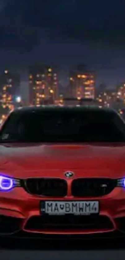 Red car with glowing lights against city skyline at night.