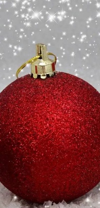 Red glittery Christmas ornament with sparkles.