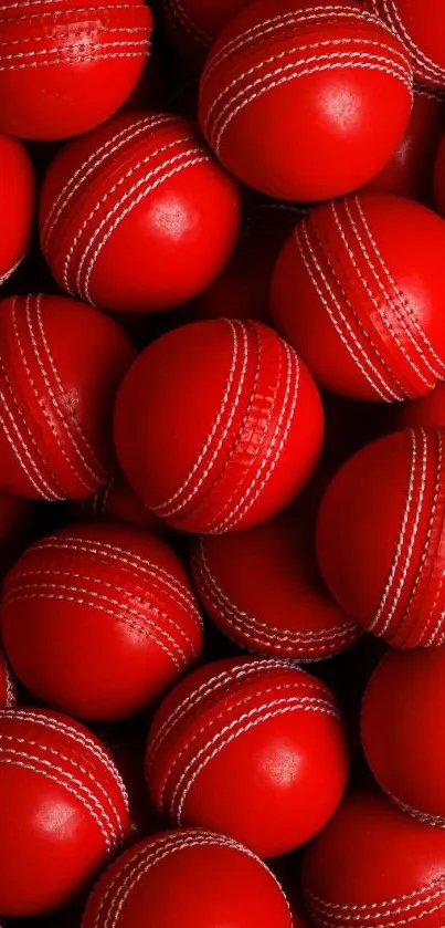 Vibrant red cricket balls with white seams, perfect sports wallpaper for mobile.