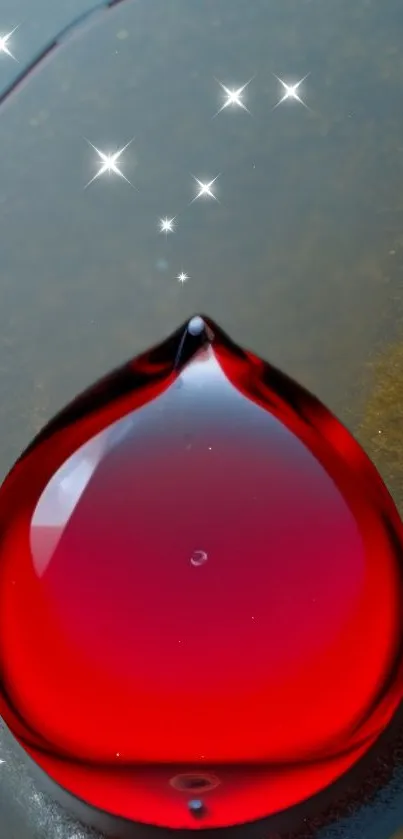 Red droplet with stars on a dark background.