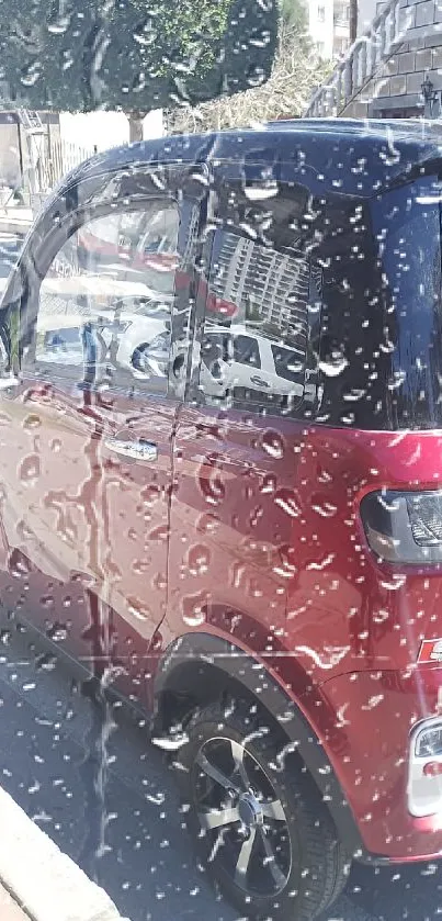 Small red electric car parked on urban street.