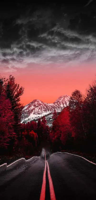 Red-tinted mountain road at sunset with dramatic sky.