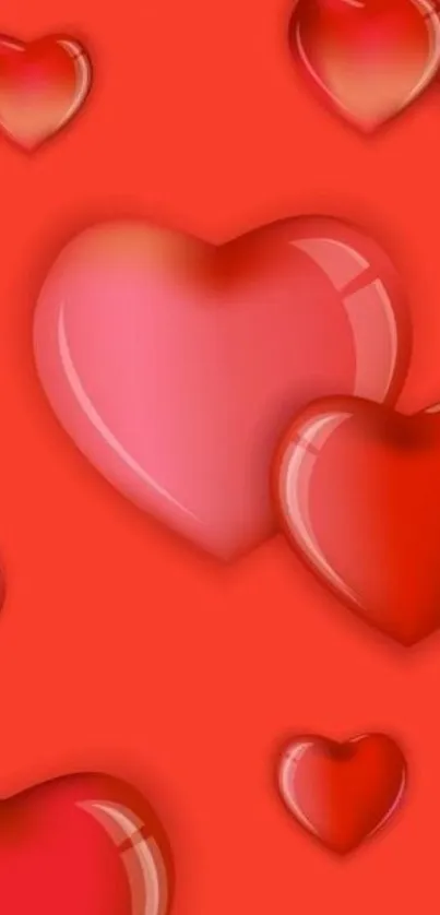 Glossy red hearts on mobile wallpaper background.