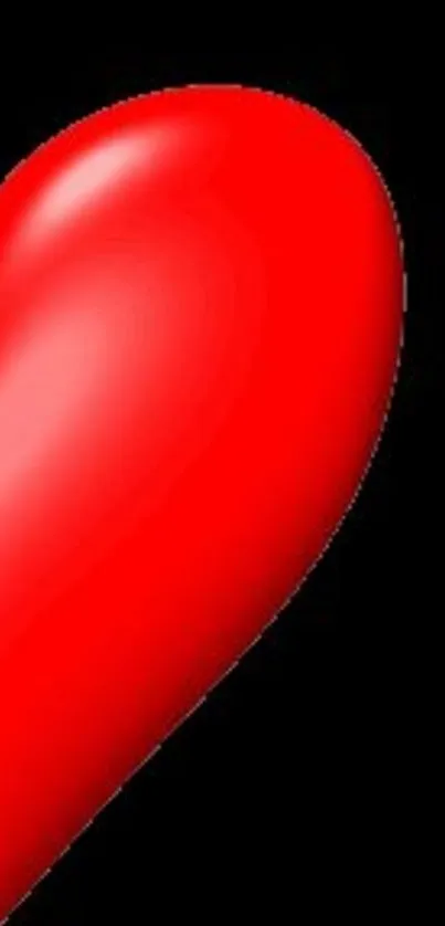 A vibrant red heart on a black background.