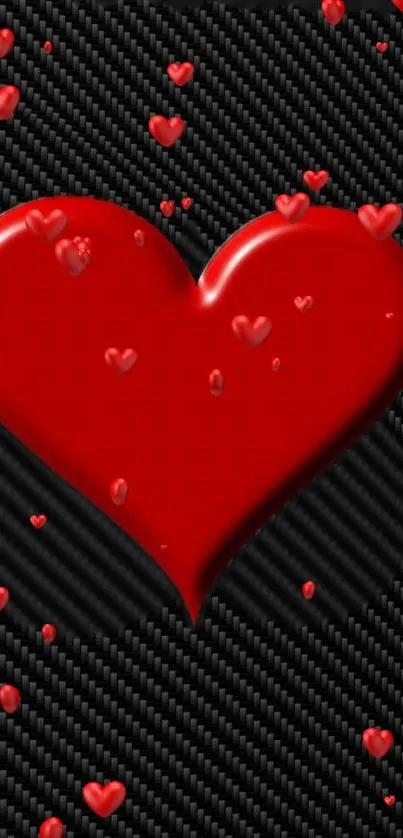 Red heart on carbon fiber background with smaller hearts.