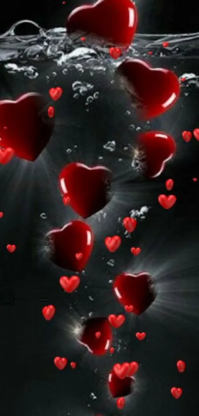 Red hearts submerged in water with a dark background.