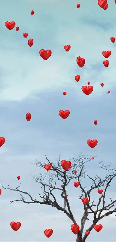 Mobile wallpaper with red hearts and a tree against a cloudy sky.