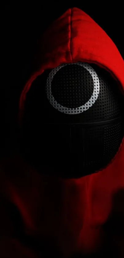 A red hooded figure stands out against a black background.