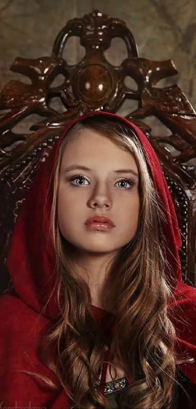 Mysterious girl in red hooded cape seated on ornate chair.