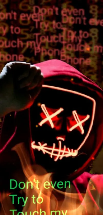 Red hoodie with glowing mask and bold text wallpaper