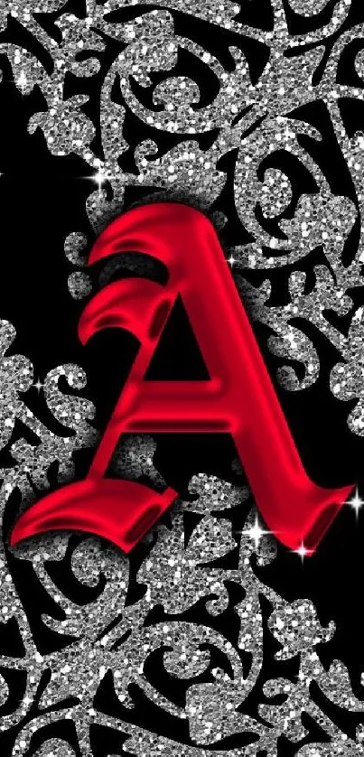 Red letter A with silver floral pattern on black wallpaper