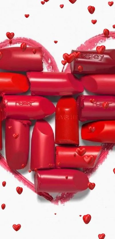 Red lipstick chunks shaped into a heart on a white background.