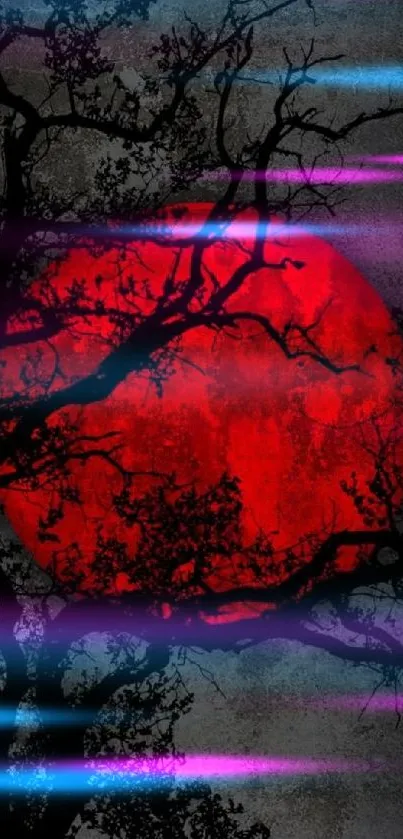 Silhouetted branches with a red full moon in the background.