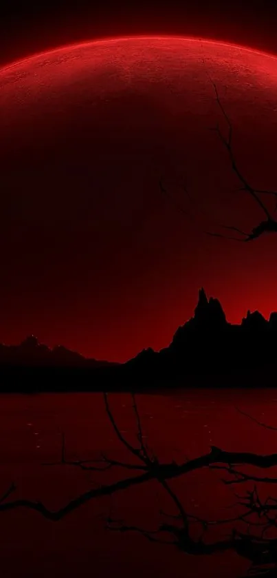 A dark and red moonlit landscape with silhouetted branches and mountains.