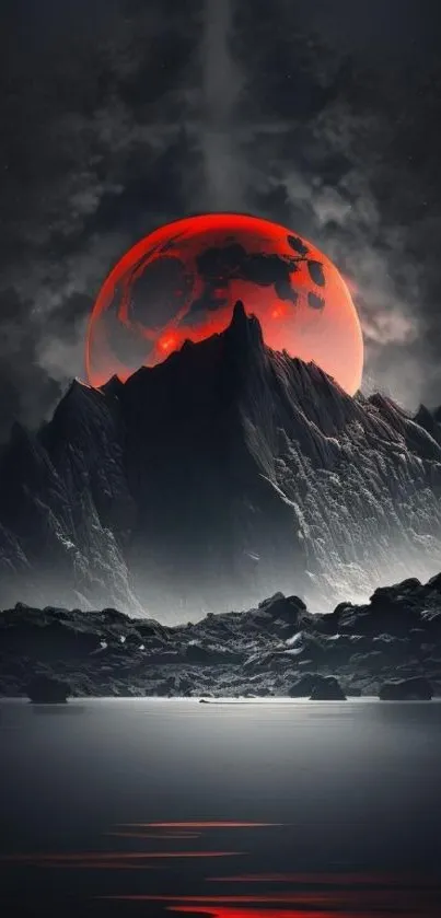 Red moon rising over mountain with dark sky.