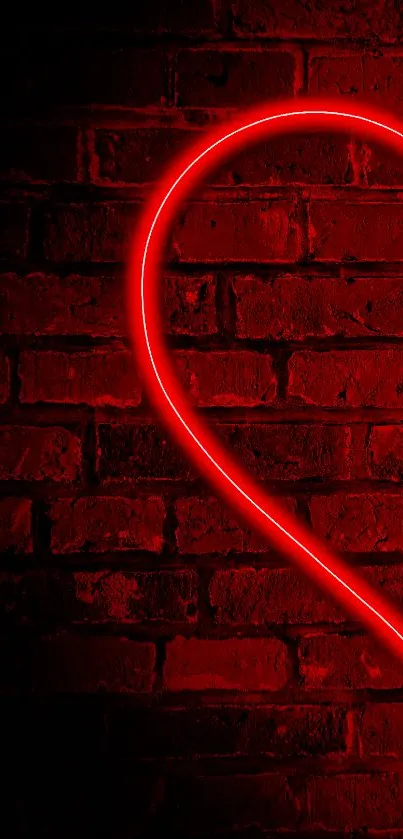 Red neon heart glowing on a brick wall.