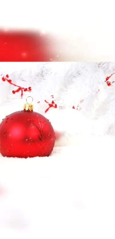 Red Christmas ornament on white background with decorative elements.