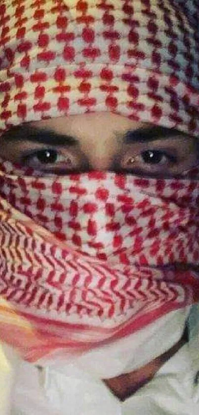 Man wearing red and white patterned veil.