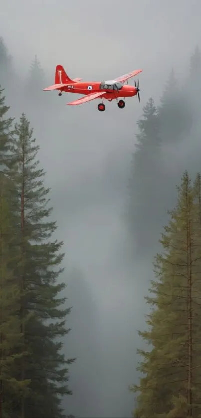 Red airplane flying over misty forest landscape.