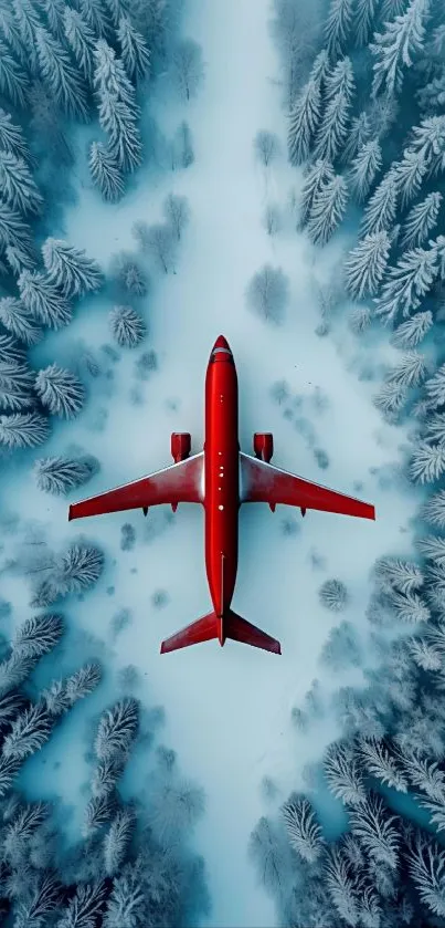 A red plane flies over a snow-covered forest landscape, viewed from above.