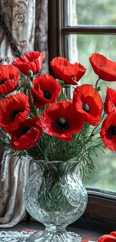 Red poppies in a vase by a window.