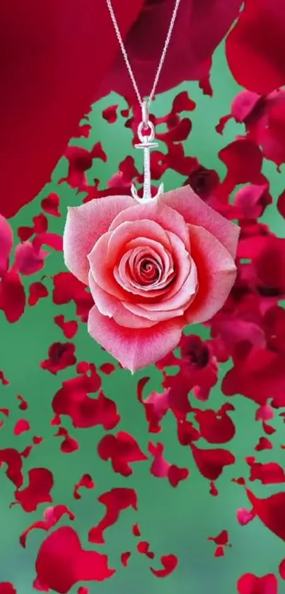 Red rose pendant with falling petals on a green background.