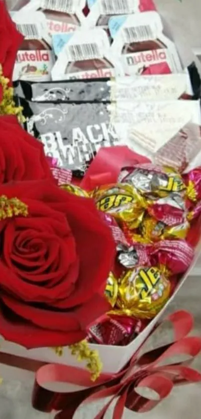 Beautiful red roses with assorted chocolates and candies in an elegant arrangement.