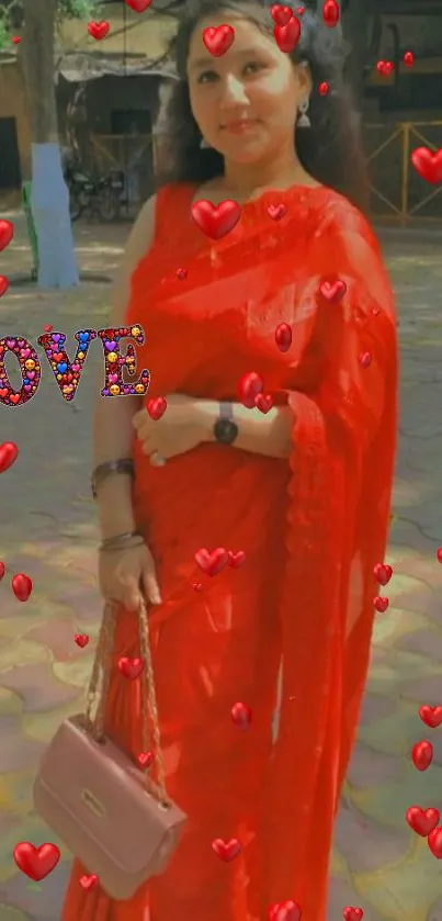 Woman in red saree with heart decorations.