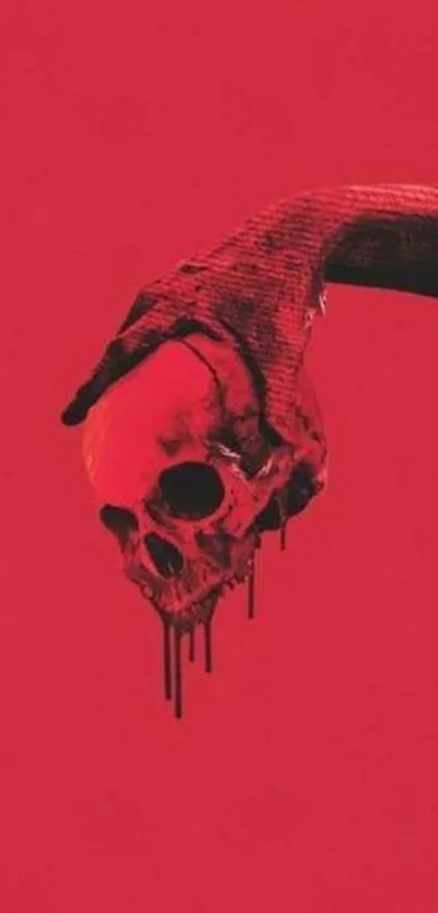 Red wallpaper featuring a hand holding a skull with a dramatic effect.