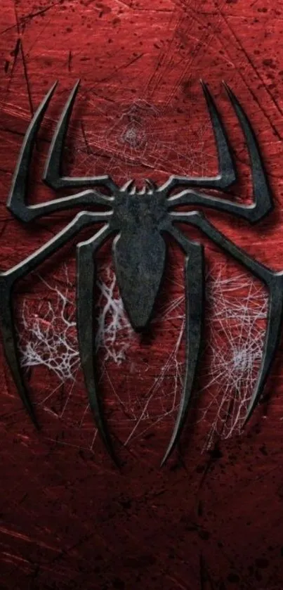 Wallpaper of a black spider emblem on a red textured background.