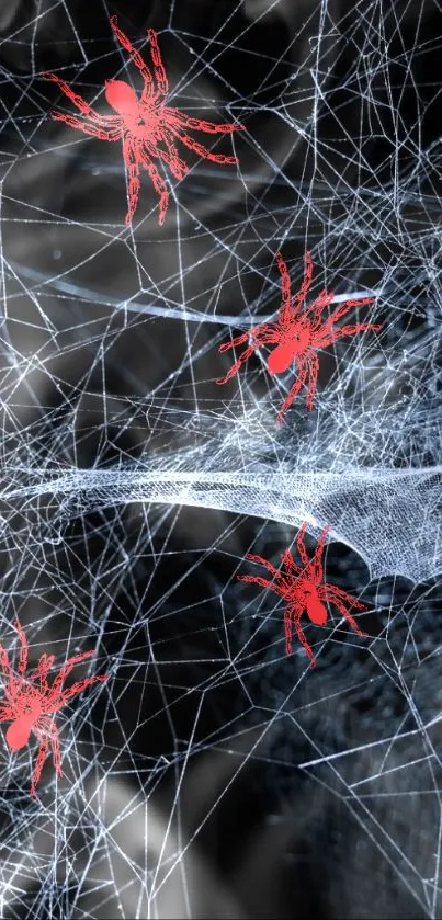 Artwork of red spiders on a black spider web.