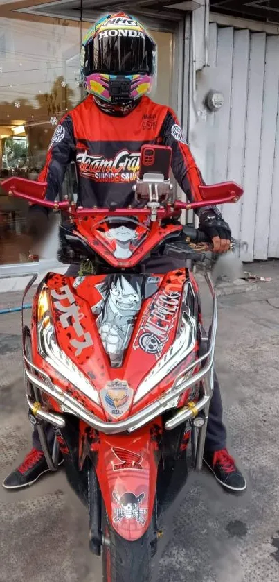 Red motorcycle and rider in striking gear on a road.