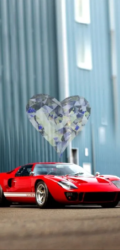 Red sports car with crystal heart overlay in an industrial setting.