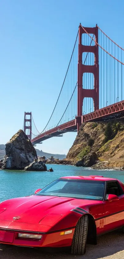Red sports car by the Golden Gate Bridge in bright sunlight.