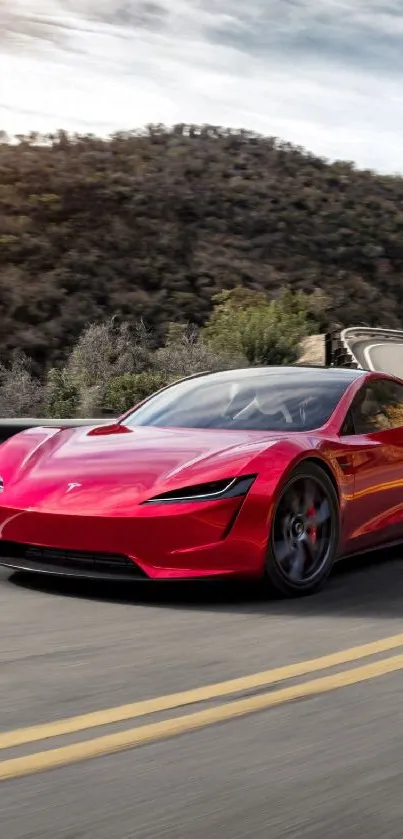 Red sports car driving on a highway at sunset.