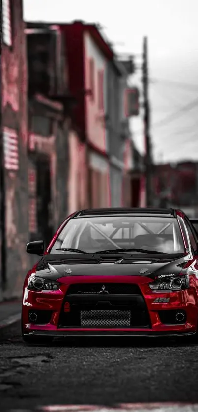 Red sports car parked on a city street, perfect for mobile wallpaper.