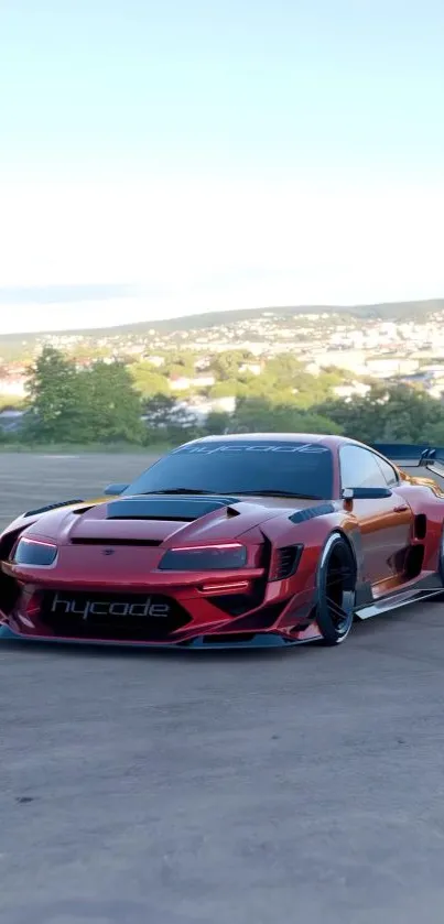 Red sports car parked in open terrain with urban backdrop, clear sky above.