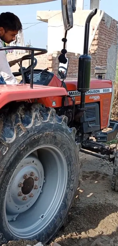 Red Massey Ferguson 9500 tractor in a rural field setting.