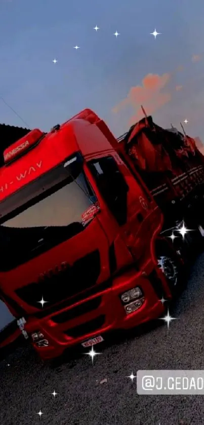 Red truck at sunset with vibrant sky.