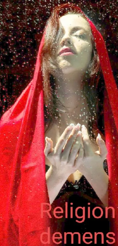 A woman under a vibrant red veil with sparkles creates a mystical atmosphere.