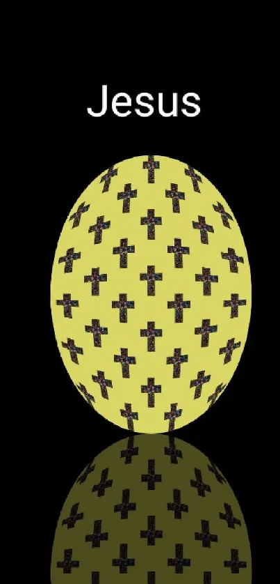 Reflective egg with cross pattern on a black background.