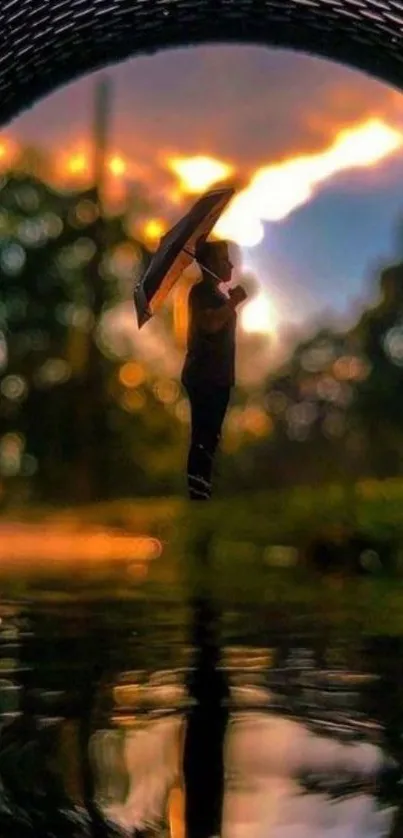 Silhouette with umbrella at sunrise, reflecting over a serene water scene.