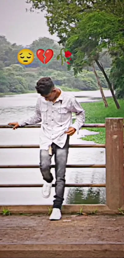 Thoughtful person by a tranquil lake, surrounded by greenery and serene views.