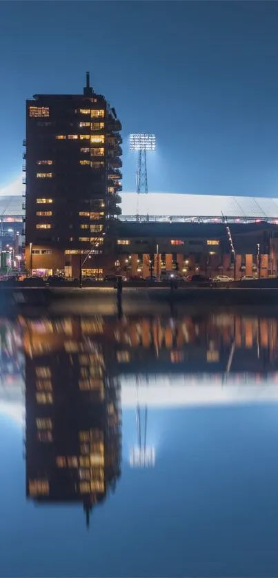 Beautiful urban skyline reflecting on water under a blue night sky wallpaper.