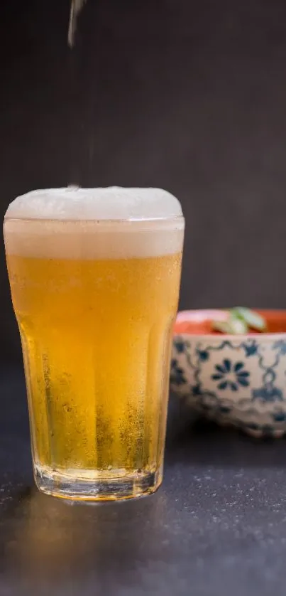 Frosty beer glass with bokeh background.